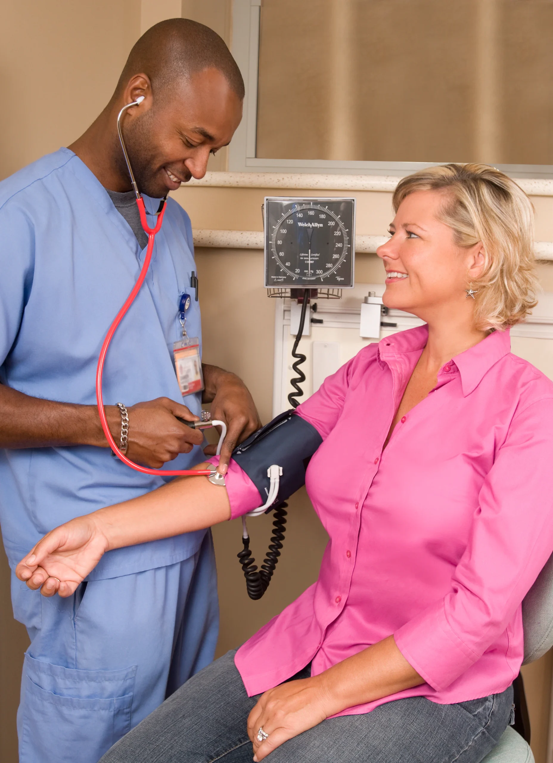 Nurse checking a client’s blood pressure
