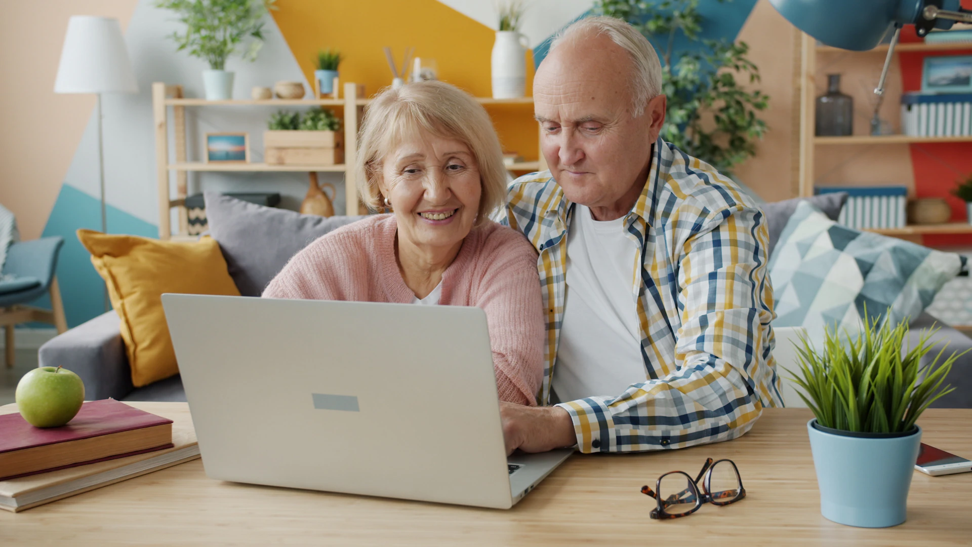 Older couple looking at a laptop together