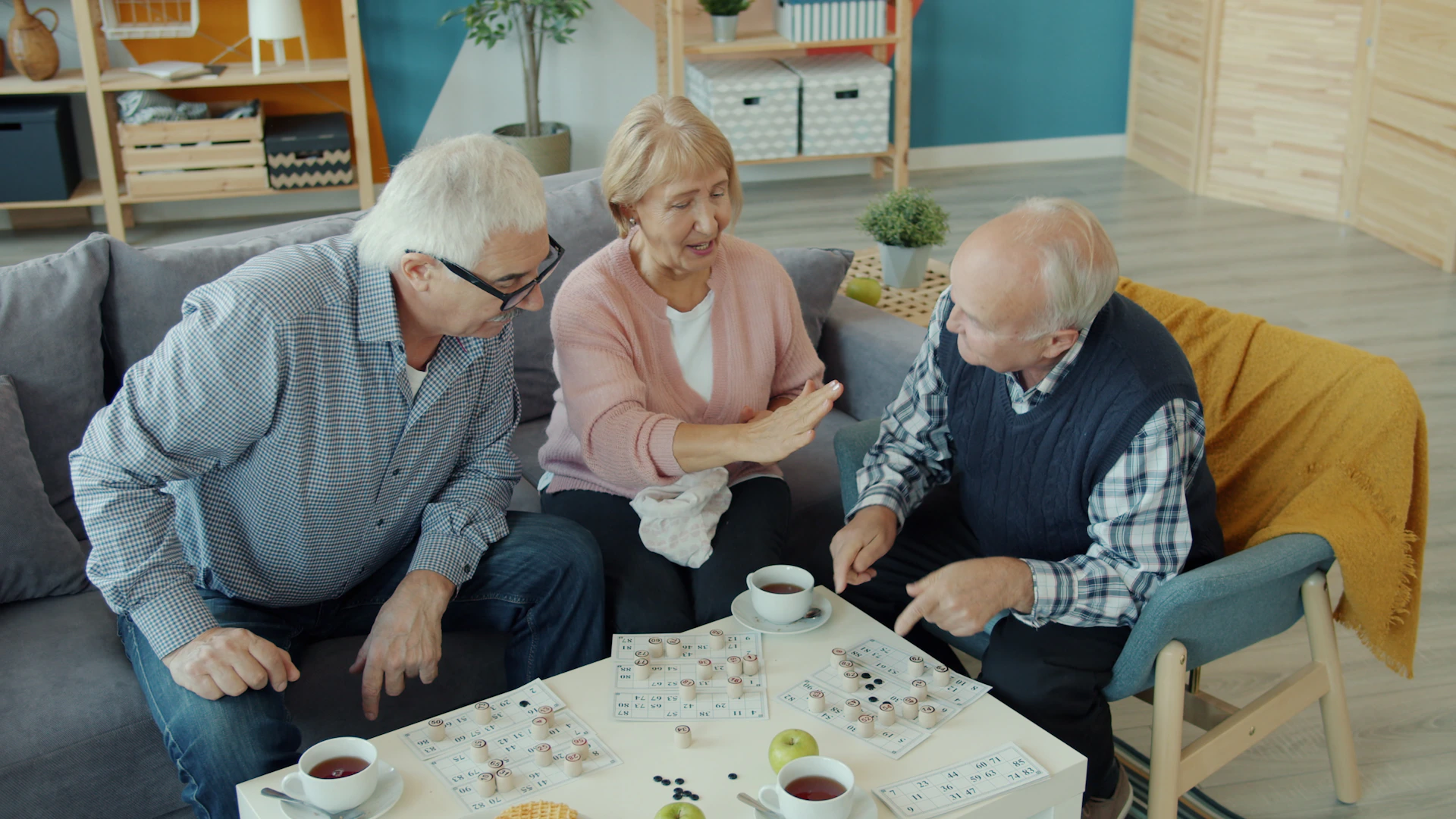 Older people enjoying coffee and a puzzle together